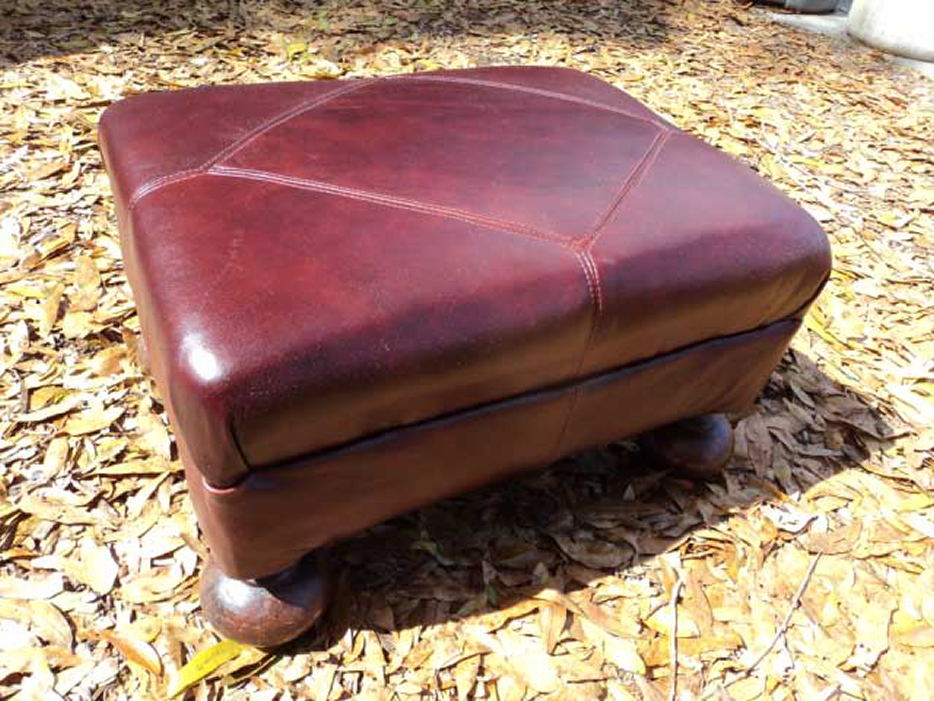 Footstool in leather